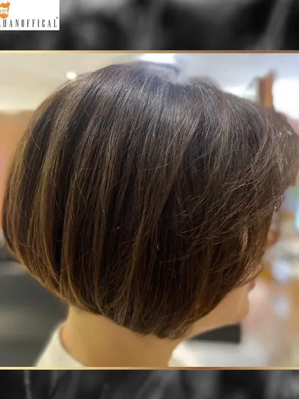 A side profile of the golden highlighted bob, showing how the light catches the different tones and accentuates the cut's shape.