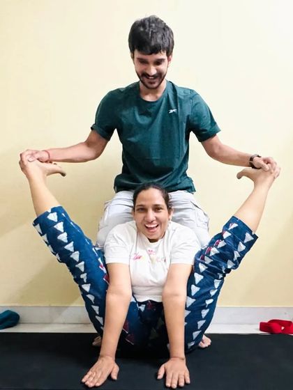 A fun and supportive moment in a personal session. Partner-assisted stretches can help you go deeper than you could on your own, building both flexibility and trust.