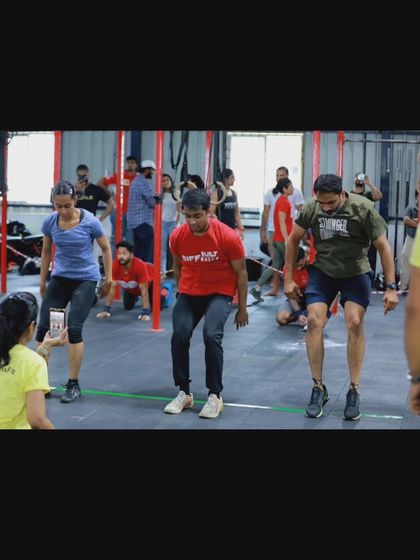 An athlete mid-burpee during a competition. These events are a nerve-wracking but rewarding first experience for many of our members, pushing them to new personal records.