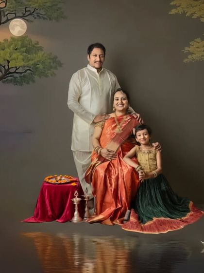 An artistic edit of a traditional family maternity shoot. The addition of a swan and water reflections transforms the portrait into a magical, dream-like scene.