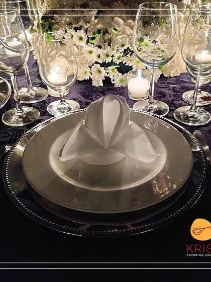 We believe the ambiance is as important as the food. This elegant table setting with fine china, glassware, and floral centerpieces demonstrates our commitment to creating a complete and sophisticated dining experience.