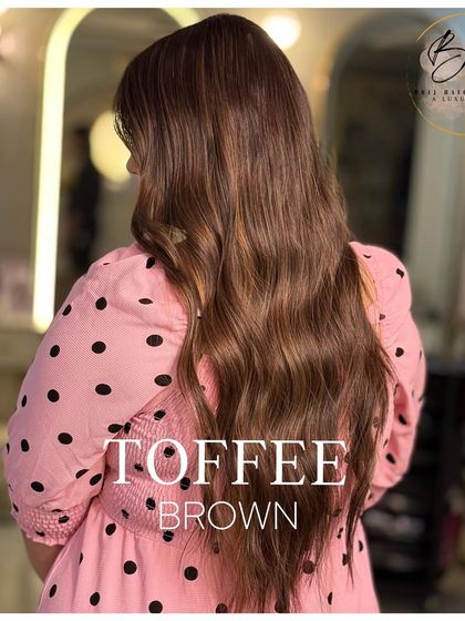 A side view of the toffee brown hair, showing how the warm, dimensional tones are woven through the lengths for a glamorous finish.