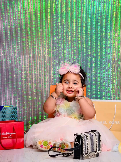 A little fashionista surrounded by shopping bags. This fun and glamorous theme is perfect for capturing a child with a big personality and a love for style.