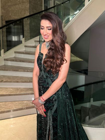 Another angle of the emerald glam, showing the beautiful soft waves and the way the makeup enhances her features.