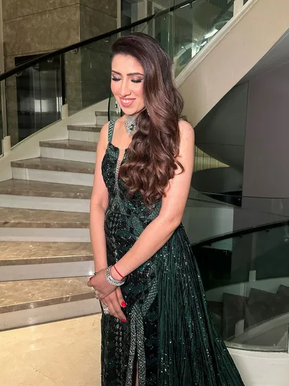 Another angle of the emerald glam, showing the beautiful soft waves and the way the makeup enhances her features.