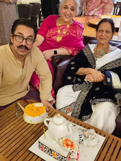 A treasured photo of Aamir Khan with his mother and family, celebrating her birthday with the custom teapot cake I created. It's an honor to be the baker for this wonderful family's celebrations.