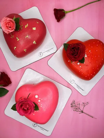 Love comes in many flavors. Here is a trio of our heart-shaped cakes, perfect for Valentine's Day, anniversaries, or just to say "I love you." Each one is uniquely decorated, from gold-flaked red fondant to fresh roses.