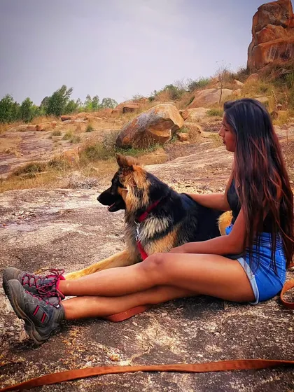 Taking a rest together on a rocky trail. Adventures are so much better with your best friend. I teach the skills, like a solid "stay," that make moments like this possible.