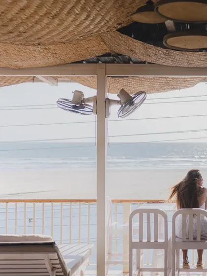 A quiet, atmospheric shot from a beachside cafe. This photo sets the scene and captures the serene, laid-back vibe of a Goan pre-wedding shoot.