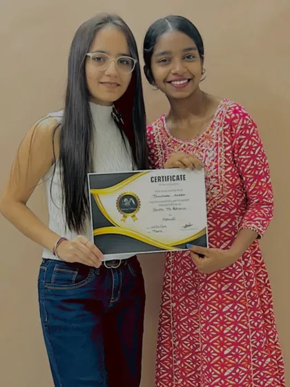 It's a proud moment when a student completes their journey. Here I am with a graduate of the Basic to Bridal course, presenting her with the professional certificate.