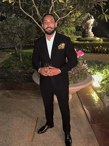 Dressed in a classic black suit for a wedding reception. I believe the DJ's presentation is just as important as the music, adding to the overall class of your event.
