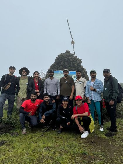 The team at the Kumara Parvatha summit after completing the 21 km circuit trek. It's a tough journey, but the sense of accomplishment is immense.