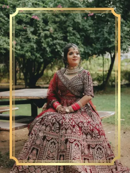 A gorgeous client radiating elegance in an exquisite maroon bridal lehenga.