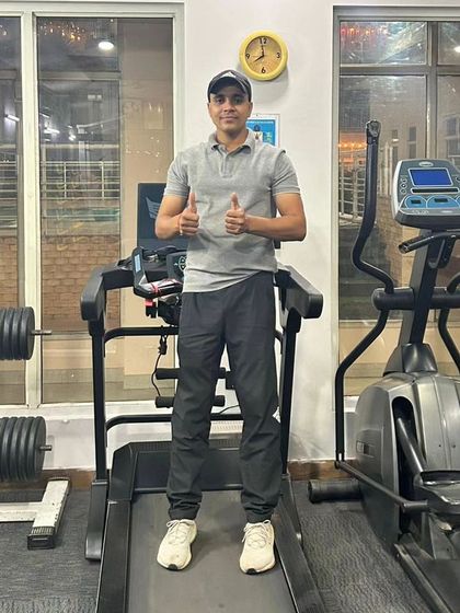 A moment of satisfaction after a good treadmill session. Consistent cardio is the key to building the endurance needed for any sport.