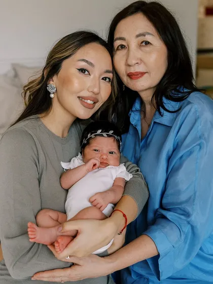 Three generations of love. A beautiful portrait of a new mother, her own mother, and the newborn baby, a treasured family heirloom.