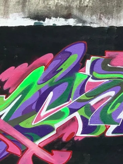 A different angle of the purple and green piece, showing how it fits into its urban environment.