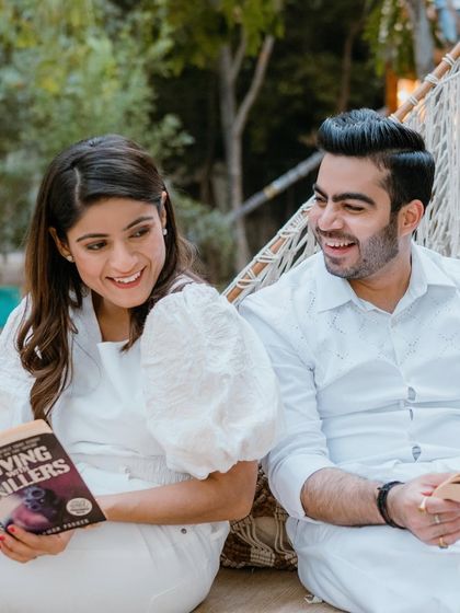 A close-up of the happy couple. The makeup is clean and radiant, highlighting her beautiful smile.