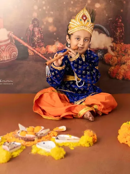 My little Krishna playing his flute. Themed shoots are a wonderful way to celebrate festivals and create unique, memorable portraits of your children.