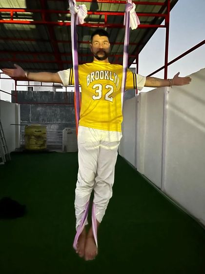 Welcome to the first aerial yoga center in Najafgarh. I am standing here, ready to help you connect with the air element.