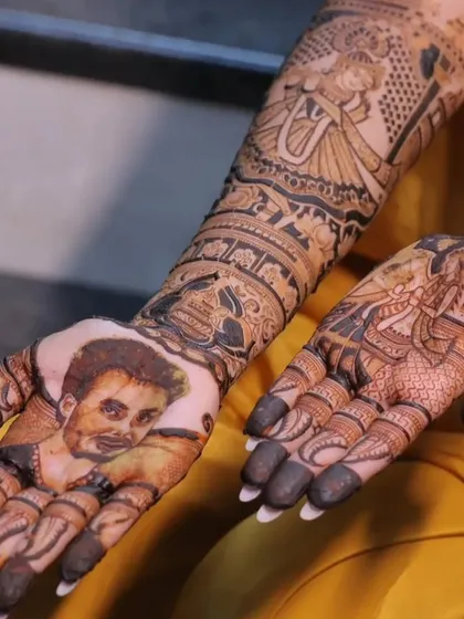 A close-up of a personalized portrait. I can even create a likeness of the groom from a photo, making the mehndi design a special surprise for him.