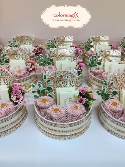 A collection of our round wedding favor hampers, showcasing a consistent and elegant design perfect for large guest lists.