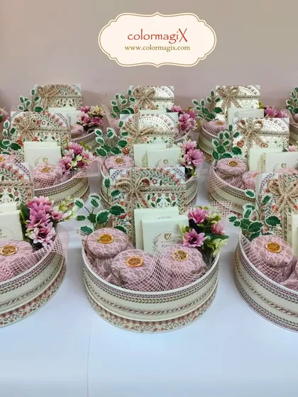 A collection of our round wedding favor hampers, showcasing a consistent and elegant design perfect for large guest lists.