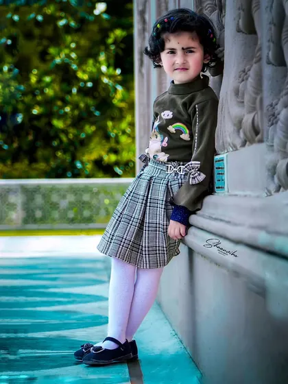 A full-length portrait of my daughter, showing her confident pose and stylish outfit. This kind of kids fashion photography is great for capturing their growing personality.