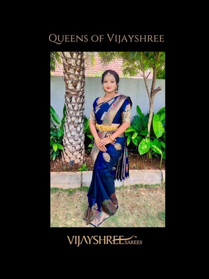 Manasa Gowda looking regal in a deep blue Banarasi-style Kanjivaram. The intricate weaving and the traditional gold jewelry pairing create a truly royal look.