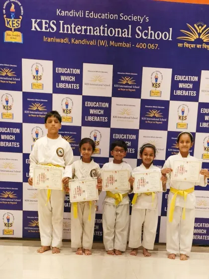 These five students have worked hard to earn their yellow belts. Their dedication at our KES International School program is commendable.