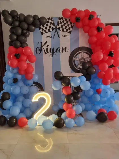Another angle of the 'Two Fast' birthday decoration, highlighting the light-up number and balloon colors.