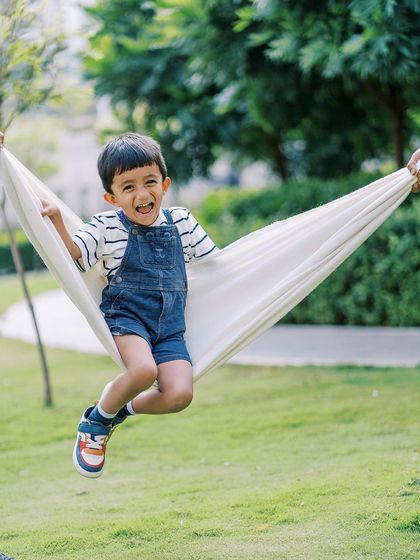 A brother swinging his sister in a blanket. The pure joy and laughter are what make this shot so special.