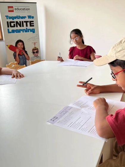 Another angle of our students taking the IRO entrance test, showcasing the serious and focused atmosphere as they work to qualify for the training program.