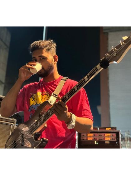 A quick coffee break for our bassist during a long sound check for a medical college fest.