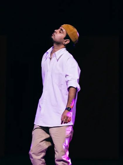 A student holding the stage during a solo section of a group piece. I choreograph moments that allow individual dancers to shine and showcase their unique strengths.