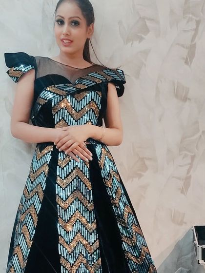 Another look at the striking black and blue sequin gown, perfect for a client who wants to make a bold statement.