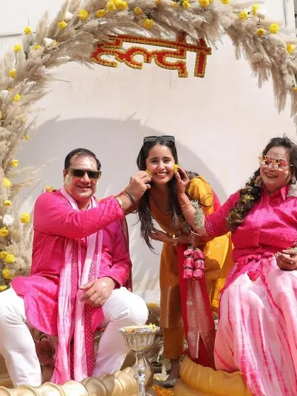 A happy family moment during the Haldi ceremony. Our backdrops are designed to be the perfect setting for capturing these precious memories.