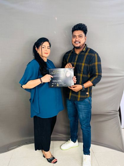 Handing out another certificate to a deserving student. Her passion for hairstyling is inspiring.