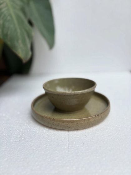 A closer look at the Green Celadon snack plate and bowl. The glaze has a lovely depth and subtle speckling, showing the unique character of our handmade ceramics.