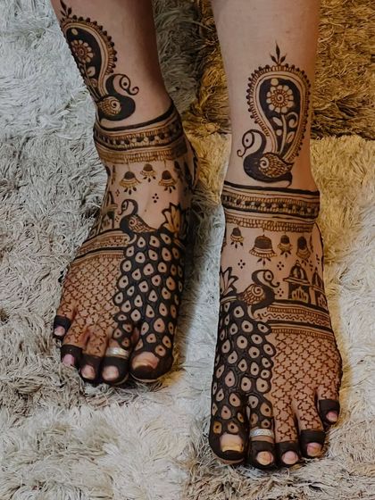 This view highlights the personalized elements in the foot design, including temple bell and dome motifs.