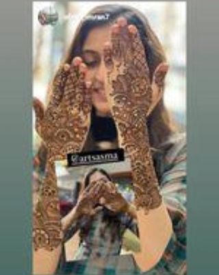 A happy client posing with her intricate full-hand mehendi. Seeing my clients happy is the best part of my job.