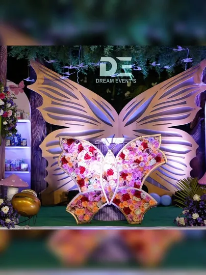 I love bringing a child's birthday theme to life. For this celebration, I created an enchanted forest with a magnificent butterfly centerpiece, using a mix of floral arrangements and custom-built structures to make the fantasy feel real.