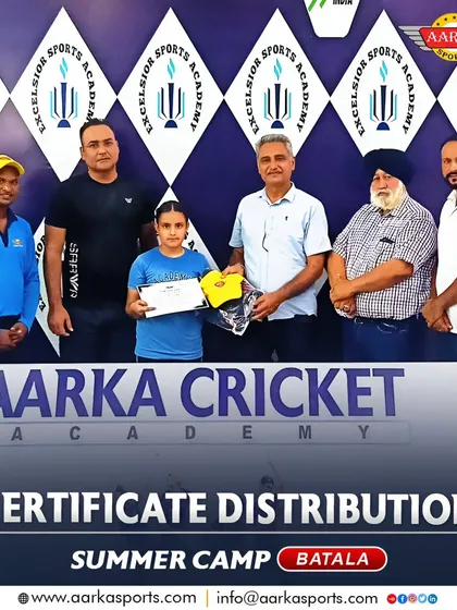 A young female cricketer proudly accepts her summer camp certificate. I am committed to nurturing talent in both boys and girls at my academy.