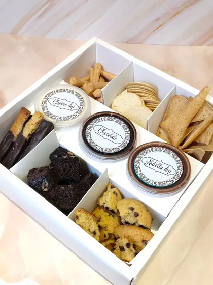 Our Rakshabandhan fondue box, which includes a variety of dippables like mini donuts, cookies, and crackers, along with three delicious dips: cheese, chocolate, and Nutella.