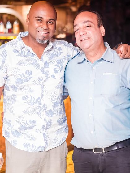 With a friend at the bar. My events are not just about music, but also about creating a friendly and social atmosphere.