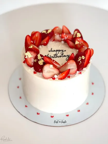 A seasonal favorite, this Vanilla Strawberry cake is topped with fresh strawberries, edible gold leaf, and tiny sugar pearls. It's available as a celebration cake or a smaller bento cake.