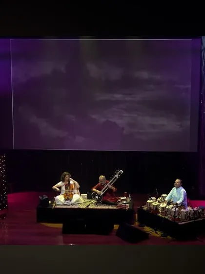 A beautiful stage setup at the Nita Mukesh Ambani Cultural Centre, with paintings projected behind us. This "See the Music, Hear the Paintings" concept adds a wonderful visual layer to the performance.