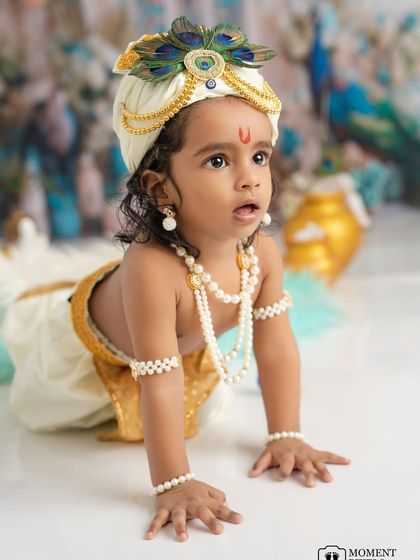 The divine innocence of a child. This little Krishna, crawling towards the camera, has a sparkle in his eye that is pure magic.