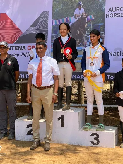 Dhiya on the podium after clinching the bronze medal in the Dressage Trot test at the Auroville Horse Show.