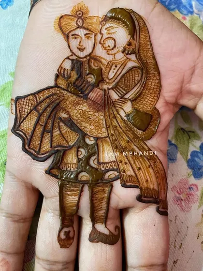 The finished portrait of a groom carrying his bride, filled with intricate shading and detail. This is a popular and romantic pose that I can customize for your mehndi.