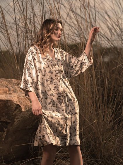 Capturing the model in a moment of interaction with her surroundings. This type of shot adds a narrative element to a lookbook, making the collection feel more alive and aspirational.